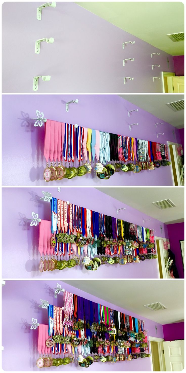 there are three rows of ribbons hanging on the wall and in front of each other