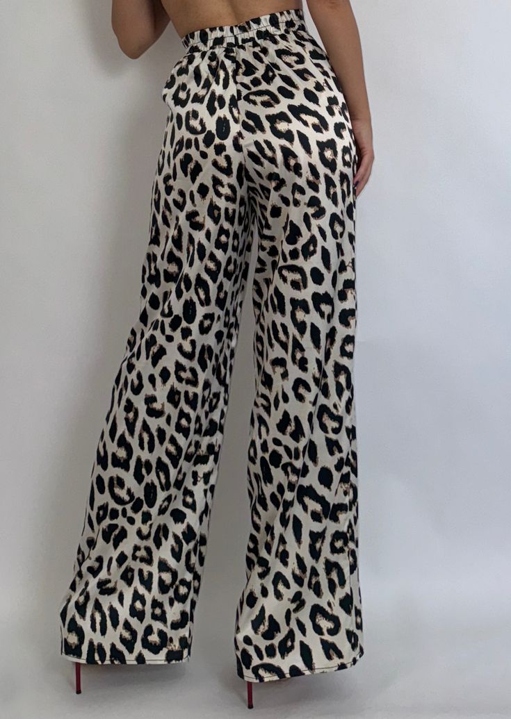 Step into Fall in our Wild Side Leopard Pants. Stylish and chic, these timeless pants will always be a staple in your closet! Lightweight and breathable, featuring a high waist and silky feel. 97% POLYESTER 3% SPANDEX HAND WASH, DO NOT BLEACH, DRY FLAT, LOW IRON. Jill is 5'3" and wearing a size Small. Chic Stretch Pants For Vacation, High Waist Rayon Pants For Work, High-waist Rayon Pants For Work, Chic High Waist Rayon Bottoms, Chic High-waisted Wide Leg Rayon Pants, Chic Wide Leg Loungewear Trousers, Chic Wide Leg Trousers For Loungewear, Chic Loungewear Wide Leg Trousers, Chic Straight Leg Rayon Pants