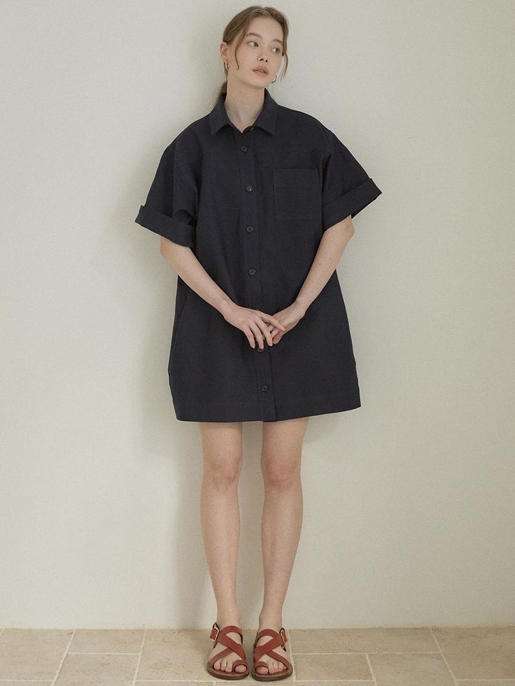 Cut from structured cotton fabric, this oversized shirt dress has wide short sleeves and mini length hem. Roll up the cuffs to accentuate the cute, casual mood. - Intended for a loose fit- Classic open collars and button fastenings through front- Casual chest pocket- Comfortable dropped shoulders- Simple, refined feel Oversized Collared Shirt Dress With Rolled Sleeves, Short Sleeve Shirt Dress With Cuffed Sleeves For Daywear, Chic Short Sleeve Shirt Dress With Rolled Sleeves, Short Sleeve Shirt Dress With Roll-up Sleeves For Daywear, Oversized Short Sleeve Workwear Dress, Oversized Short Sleeve Dresses For Work, Summer Shirt Dress With Cuffed Short Sleeves, Oversized Short Sleeve Shirt Dress With Rolled Sleeves, Oversized Shirt Dress With Rolled Sleeves