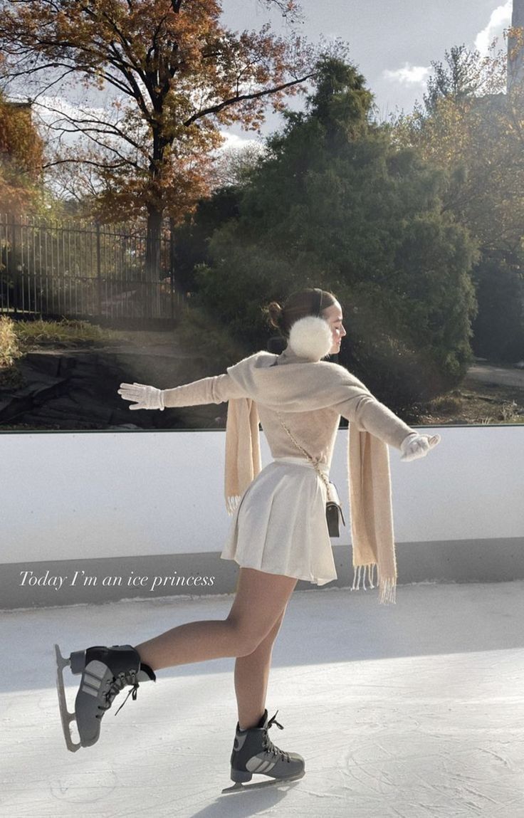 a woman skating on an ice rink with trees in the background