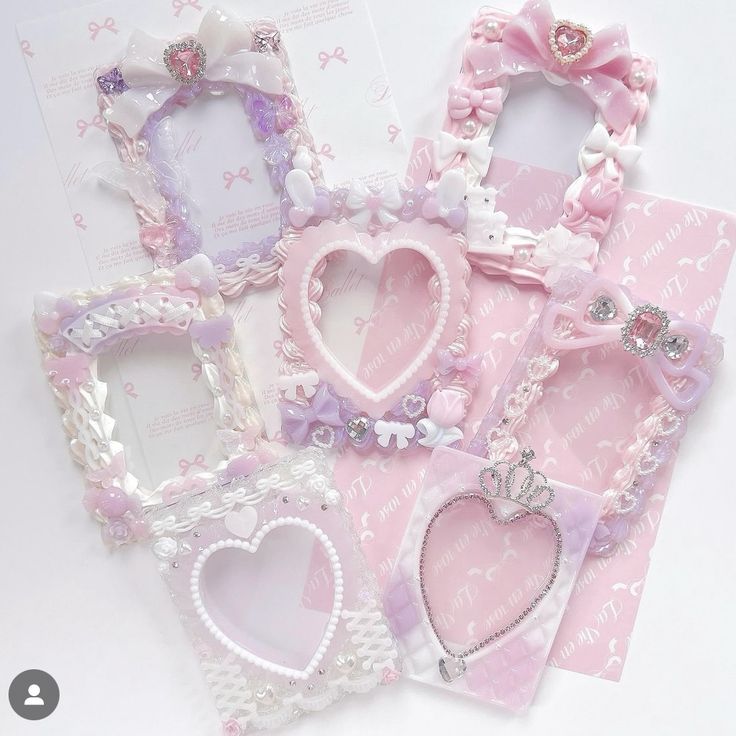 several pink and white frames with hearts on them