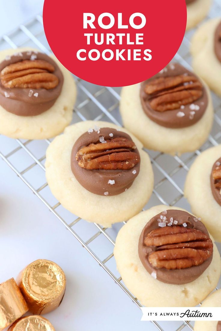 chocolate turtle shortbread cookies on a cooling rack with pecans and gold coins in the background