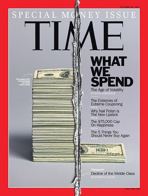 the front cover of time magazine with stacks of money sticking out of it's hole