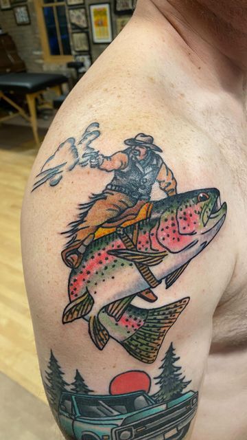 a man with a big fish on his shoulder