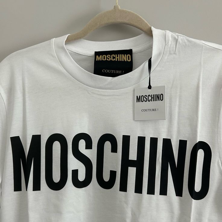 Moschino Couture Xxs Brand New With Tags Spring Cotton Tops With Logo Detail, Trendy Cotton Tops With Logo Detail, Relaxed Fit Top With Logo Detail For Spring, Spring Short Sleeve Tops With Logo Detail, Spring Short Sleeve Tops With Logo, Spring Casual T-shirt With Logo Detail, Designer Cotton Tops With Logo Print, Casual Summer Tops With Logo Detail, Spring Streetwear Tops With Logo Detail