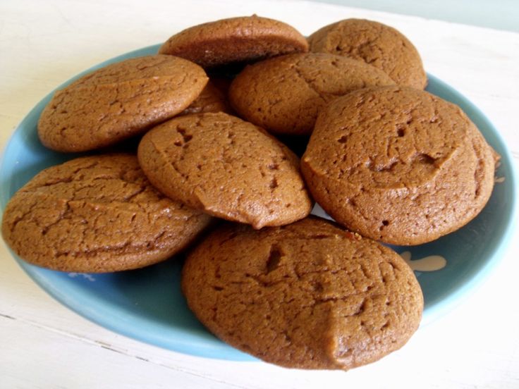 a blue plate filled with cookies on top of a table