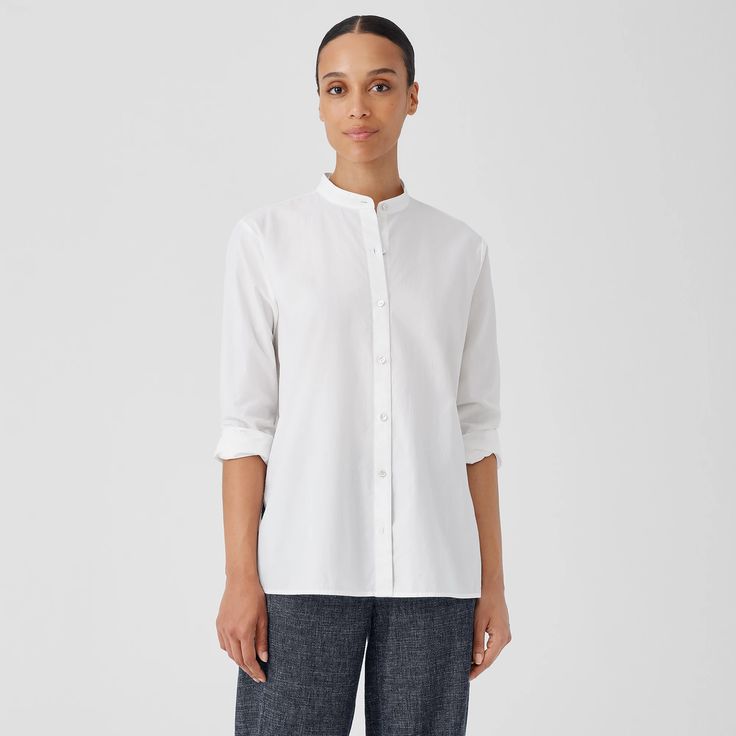 The long lines of our band collar shirt, elevated by a fine poplin weave. With a button front and side slits, in soft organic cotton. Shirt Without Collar, Band Collar Shirt, Banded Collar Shirts, White Collared Shirt, Band Collar, Crew Neck Top, Collar Shirt, Poplin Shirt, Eileen Fisher