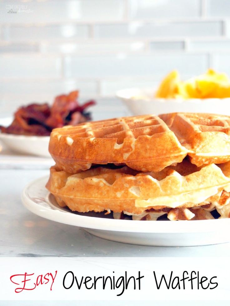 a stack of waffles sitting on top of a white plate