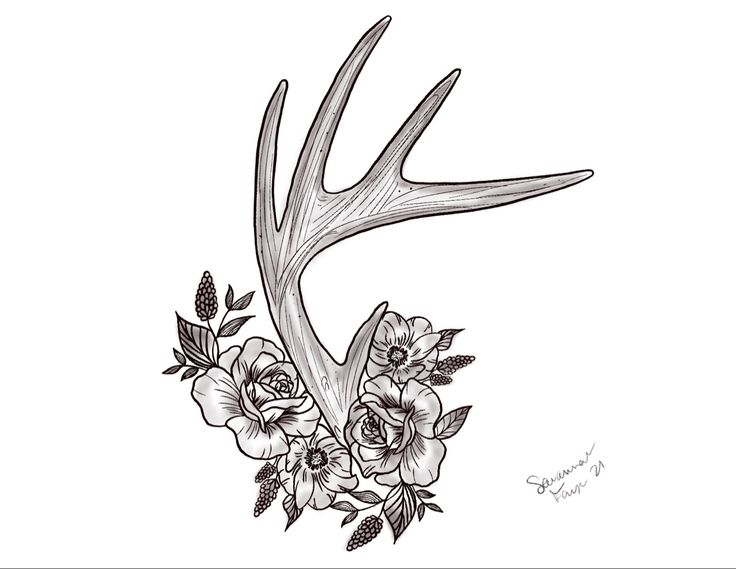 a deer's antler with flowers and leaves on it is shown in black and white