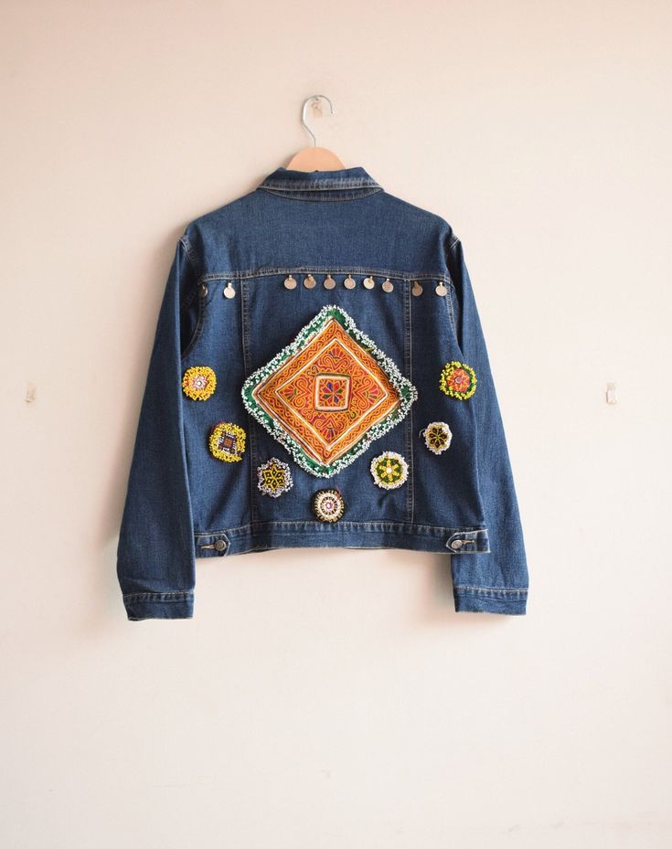 "HARMONYHANDICRAFT presenting beautiful handmade boho embroidery denim jacket with banjara work . The Denim Jacket is made with Premium denim and detailed with embroidery on the back - goes perfectly with your favorite pair jeans. It is one of kind denim jacket that last years to come. Middle blue denim fabric with colorful embroidery at the back. ❣️For boho lovers! Clothes that make you feel like a queen 👑 The jacket you will receive will be the exact one in the photos. Vintage jean jacket, Vi Jean Jacket Embroidery, Embroidery Denim Jacket, Jacket Patchwork, Denim Jacket Vintage, Jacket Embroidery, Embroidery Denim, Boho Embroidery, Vintage Jean Jacket, Boho Denim