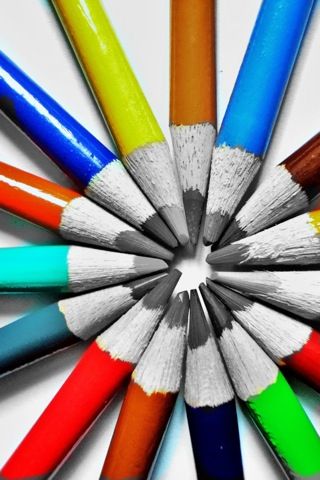 a group of pencils arranged in a circle on top of each other, with the center surrounded by smaller colored pencils