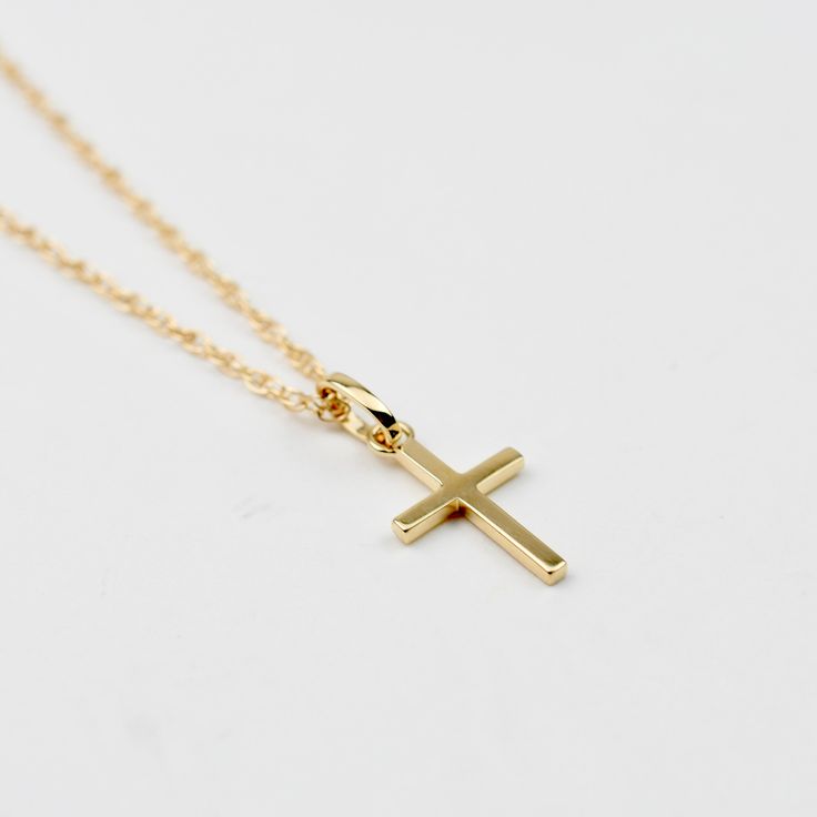 Solid Gold Cross Necklace. 14k cross pendant and necklace. This necklace is both elegant and beautiful. This is a beautiful necklace that is both timeless and precious. A great gift for graduation, communion or baptism. The necklace will arrive in a gift box, ready for delivery. The cross pendant is solid 14K gold, it is about 17mm x 10mm. 14K gold necklace All components are 14k gold Please read our policies before you place your order. https://www.etsy.com/shop/SashJewelry/policy?ref=shopinfo_ 14k Gold Cross Necklace For First Communion, Yellow Gold Cross Necklace For First Communion, Yellow Gold Cross Pendant Necklace For First Communion, 14k Gold Cross Pendant Necklace For First Communion, Classic Cross Pendant Jewelry For First Communion, Classic Cross Pendant Necklace As Gift, Elegant Pendant Necklaces For First Communion, Elegant Cross Necklace For Baptism, Elegant Crucifix Cross Necklace For Baptism