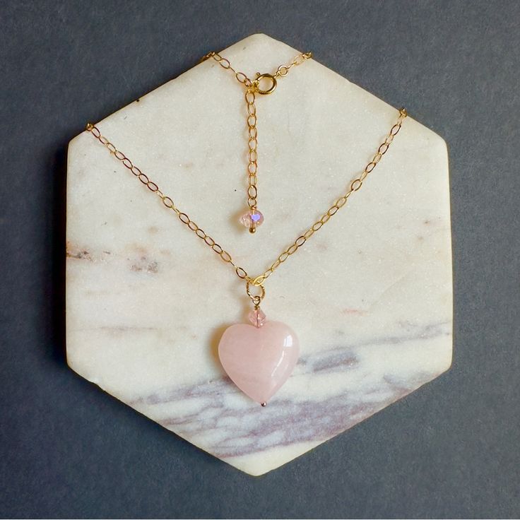 This Gorgeous Necklace Features Natural 13mm.18mm Heart Rose Quartz Pendant With Premium Quality Swarovski Crystal On 925 Sterling Silver Or 14k Gold Filled Chain With 1”Inch Extension Chain. The Extension Chain Has Been Adorned With One Natural 4mm Swarovski Crystal. Size Pendant: 13mm.25mm Chain: 16” Inches ( Custom Length Is Available). This Uniquely Designed Necklace Is A Perfect Asset For Any Occasion And Easy To Wear Everyday. Also A Great Choice Of Gift For Her. *Please Note That Each Of Pink Heart-shaped Gemstone Jewelry, Pink Gemstone Heart Necklace, Pink Heart Beads Necklace For Anniversary, Pink Round Necklace For Valentine's Day, Pink Heart Cut Gemstone Necklace, Pink Birthstone Heart Pendant Necklace, Pink Sterling Silver Necklace With Heart Beads, Pink Heart Gemstone Pendant Necklace, Pink Gold Heart Cut Jewelry With Heart Charm