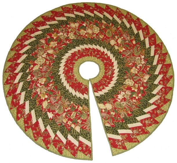 a red and green quilted christmas tree skirt