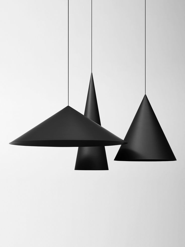 three black lamps hanging from the ceiling