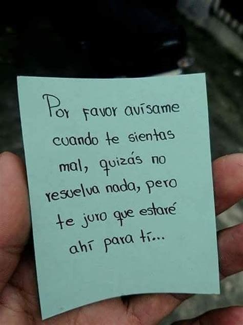 a hand holding a piece of paper with an italian poem written in spanish on it