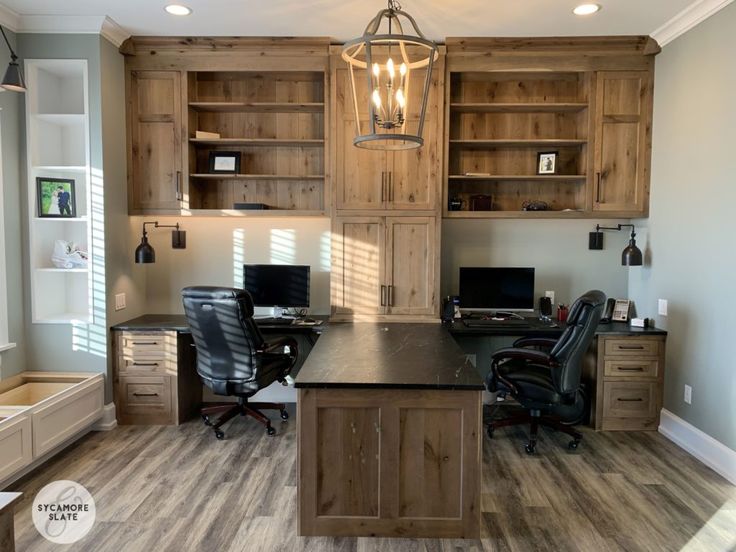 a home office with wooden cabinets and desks