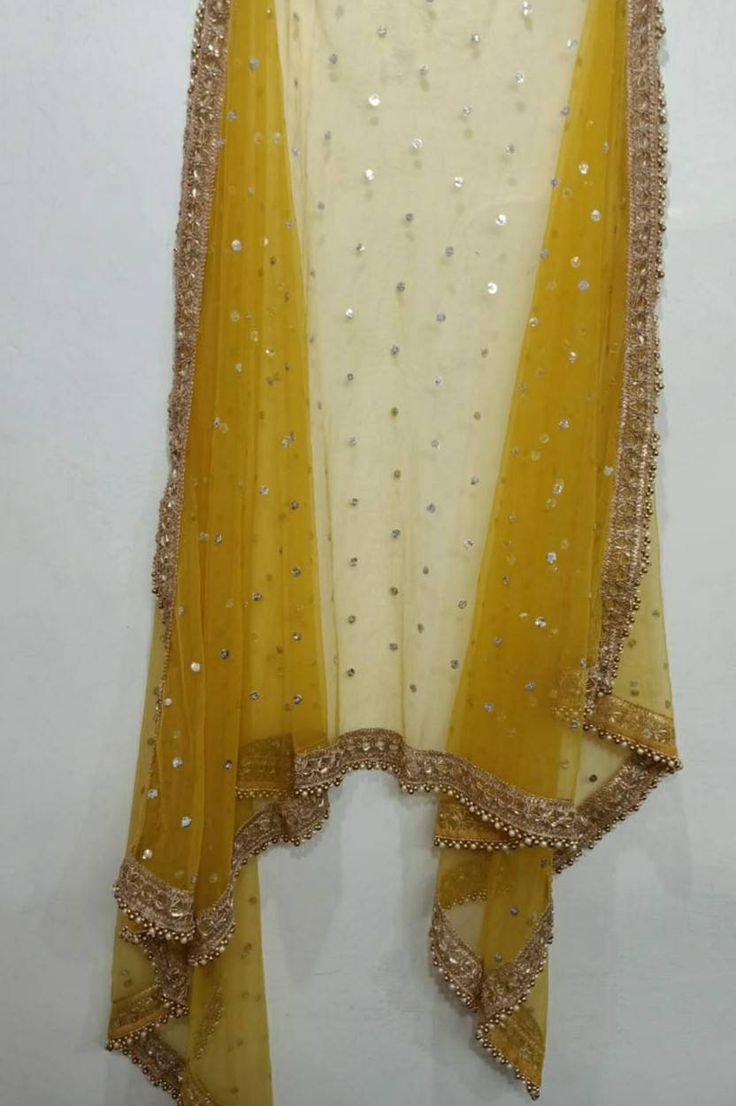 Indian dupatta for women wedding mustard yellow embroidered net. Size: Dupatta is 100 inches (2.5 meter) long and 40 inches (1 meter) wide. Length of this dupatta can be customized as per your requirement. Fabric and work: Sequins embroidered net fabric with lace border. Delivery time: This dupatta will take 3-4 days to produce after we have received your order. While ordered with standard shipping it takes around 2-3 weeks in transit after we dispatch it. You can order with a shipping upgrade, Net Dupatta Designs, Dupatta Designs Ideas, Duppattas Designs Ideas, Wedding Wear Indian, Kameez Lehenga, Yellow Dupatta, Lehenga Dupatta, Bridal Dupatta, Girls Party Wear