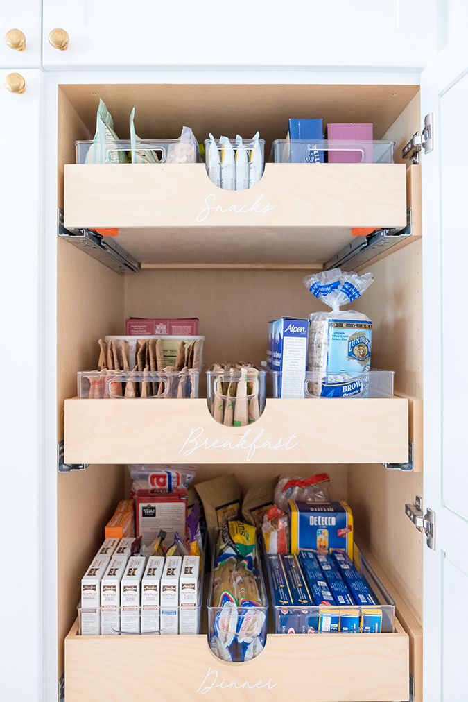 an organized pantry with lots of food in it