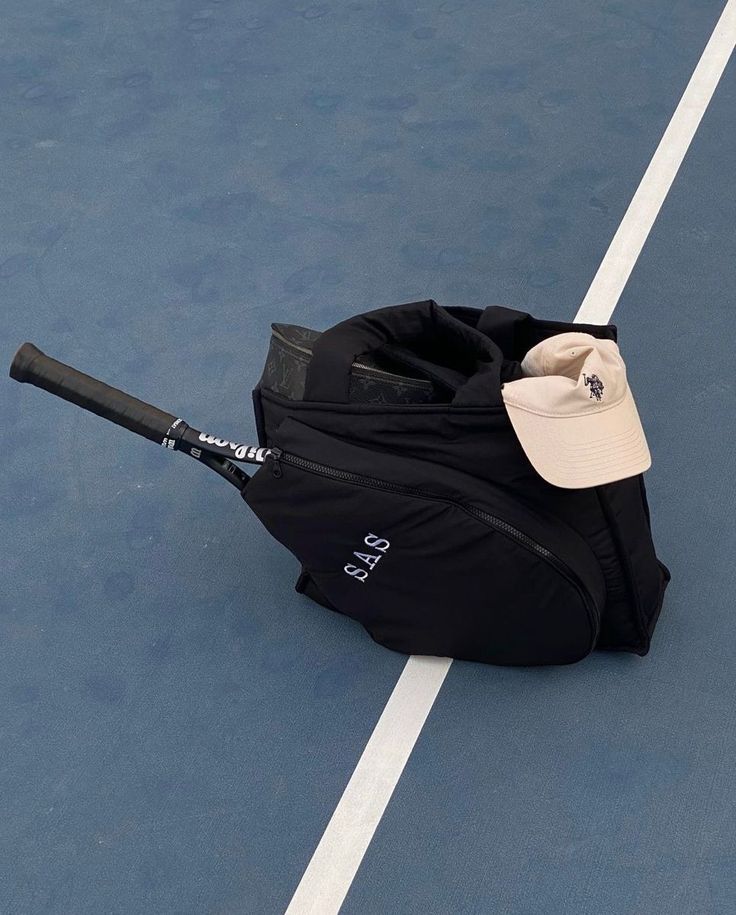 a black bag with a baseball bat sticking out of it