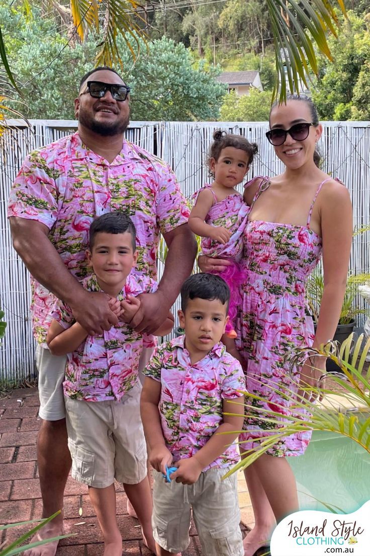 the family is posing for a photo in their matching outfits