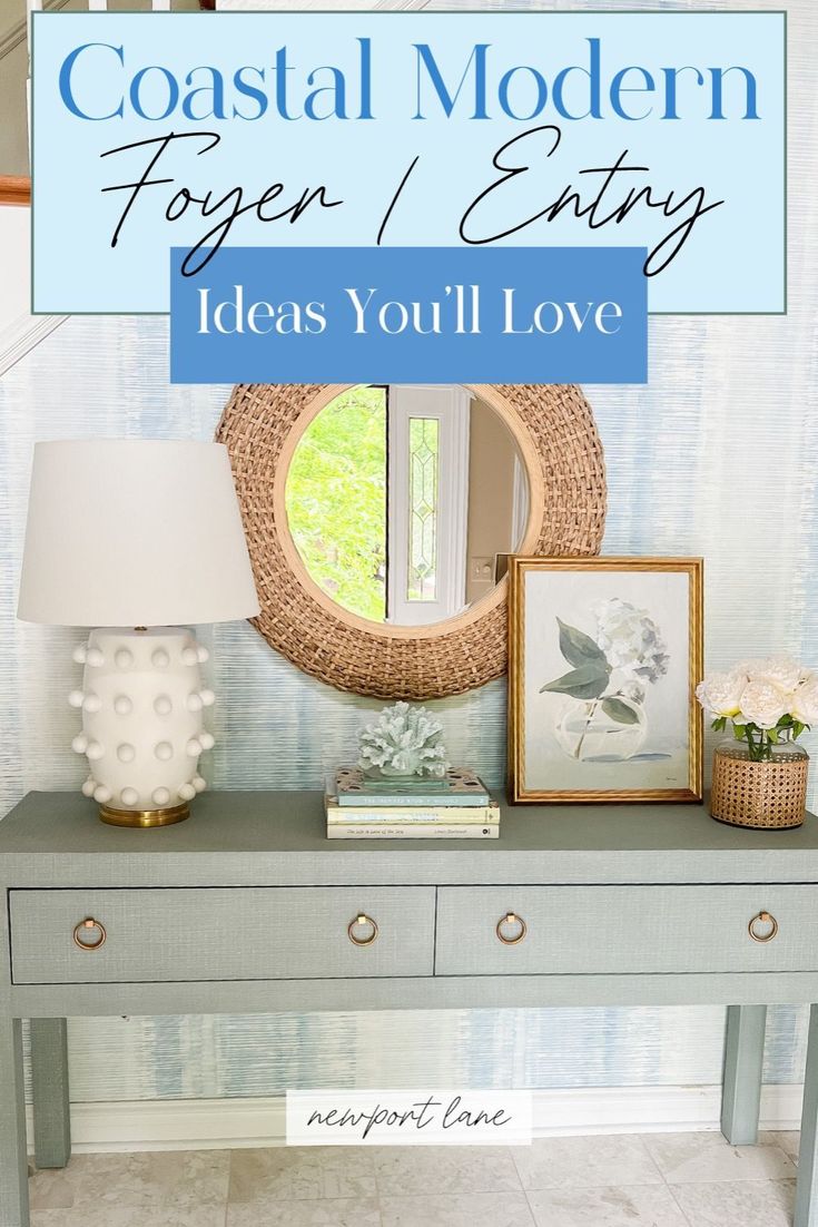 a table with pictures and a lamp on it, next to a mirror that says coastal modern