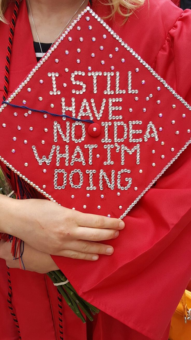 a woman wearing a red graduation cap that says i still have no idea what it is doing