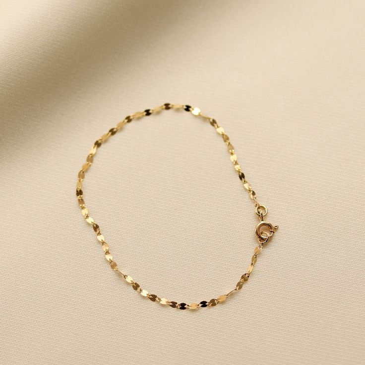 Add some sparkle to your wrist with our Glitter Chain Bracelet! Made with 14K Solid Gold, this delicate and dainty bracelet is the perfect accessory for any occasion. The glitter chain adds a touch of shine and whimsy to your outfit. Gold KT: 14K Solid Gold Gold Color: Yellow Gold Chain Lengths: 6.5", 7" Chain Widths: 2 mm Chain Style: Glitter Chain Clasp Closure: Spring Ring Elegant Paperclip Bracelet With Delicate Chain As Gift, Elegant Paperclip Bracelet With Delicate Chain For Gift, Dainty 14k Gold Filled Adjustable Chain Bracelet, Delicate 14k Gold-filled Chain Bracelet, 14k Gold Bracelets With Adjustable Chain For Party, Dainty Gold Plated Charm Bracelet With Delicate Chain, Dainty 14k Gold-filled Bracelet With Delicate Chain, Dainty Delicate Chain Bracelet As Gift, Dainty Delicate Chain Bracelet For Gifts