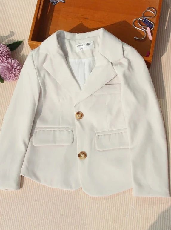 She'll be making boss moves and fashion statements in our chic blazer jacket. Clean lines and simple details make this versatile piece a closet staple for little CEOs in the making. High-quality fabric keeps her warm and cozy even on chilly days, so she can stay fabulous all day long. Easy-to-wear and pair with other pieces in her closet. Dress it up or down, however you wish! Perfect for casual day strolls, dressy events, influencer photoshoots, chic playdates, and year-round fashion fun Blazer-style jacket with button details and faux side pockets Available in sizes 24MON; 2T-16Y for toddlers and little girls White Sport Coat With Button Closure For Fall, Cotton Outerwear With Single Button, Long Sleeve School Blazer With Pockets, School Blazer With Pockets And Long Sleeves, Long Sleeve Blazer With Pockets For School, Fitted School Blazer For Fall, Fitted Blazer For School In Fall, School Outerwear With Button Closure And Long Sleeves, Long Sleeve Outerwear With Buttons For School