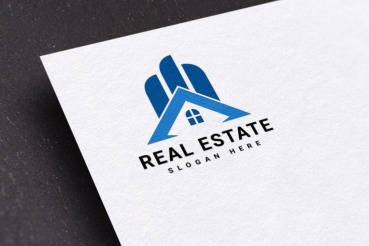 a real estate logo is shown on a white paper