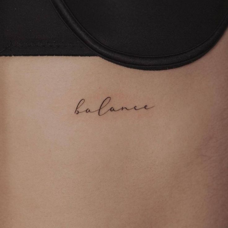 a woman's stomach with the word balance written in cursive writing on it