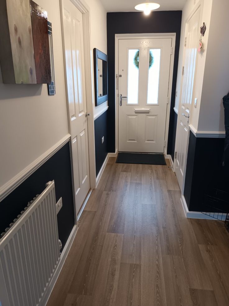 Hall in dark navy and white. Loving the result. Hall With Dado Rail, Navy And White Hallway Ideas, Hall Dado Rail Hallways, Painted Dado Rail Hallway, Dado Rail Decorating Ideas, Dado Hallway, Black Panelling Hallway, Hallway With Dado Rail, Hallway Dado Rail