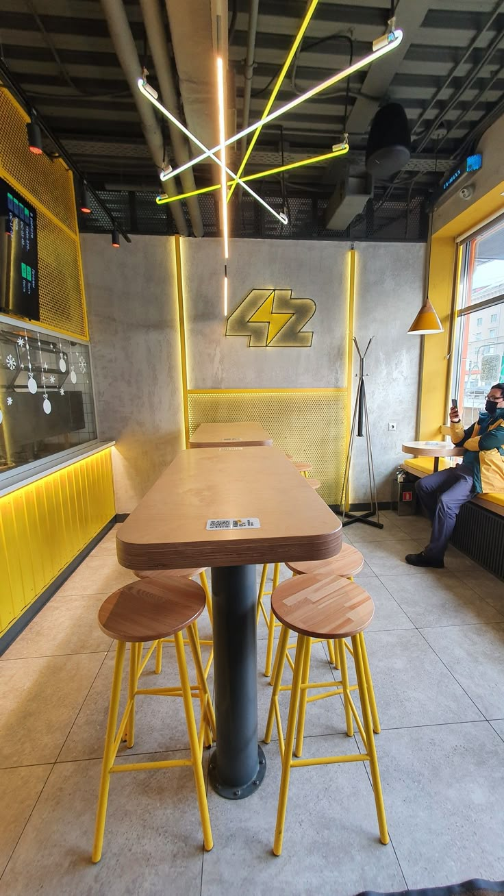 two yellow stools at a table in a restaurant