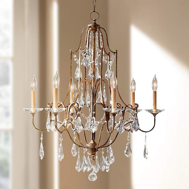 a chandelier hanging from the ceiling in a room