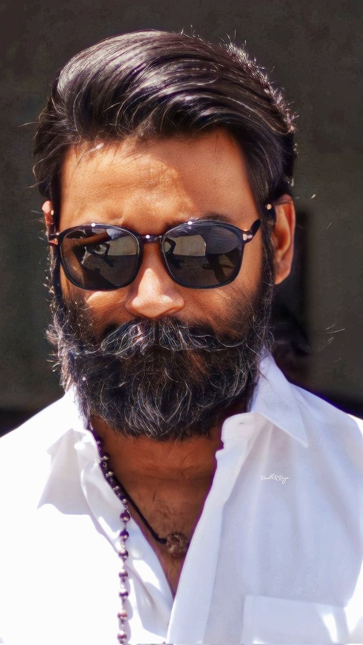 a man with sunglasses and a long beard