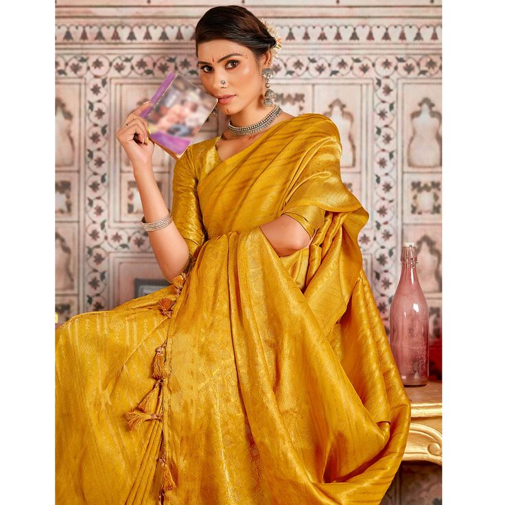 Mustard colored saree is prettified with beautiful weaving work as shown which makes it appear classy. This saree is made of art silk fabric which is accompanied with art silk blouse piece which you can customise as per your design/style. Women can buy this saree to wear for their party, festive, sangeet functions and homely events and ideal for any fashionista. Note:- The actual product may differ slightly in color and design from the one illustrated in the images when compared with computer or mobile screen. Elegant Yellow Pre-draped Saree With Zari Weaving, Traditional Diwali Slub Silk Pre-draped Saree, Festive Unstitched Slub Silk Pre-draped Saree, Elegant Slub Silk Blouse Piece For Saree, Slub Silk Pre-draped Saree For Eid Puja, Elegant Pre-draped Saree For Navratri In Slub Silk, Elegant Pre-draped Slub Silk Saree For Navratri, Handloom Slub Silk Pre-draped Saree For Diwali, Gold Anarkali Pre-draped Saree In Art Silk