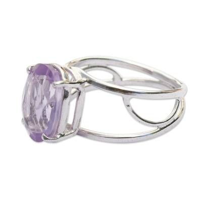 Dazzling in its beauty a three-carat amethyst centers this contemporary cocktail ring. Liliam Vivan sets the oval gemstone in an airy sterling silver setting. Faceted amethyst represents a connection with spirituality and the force of transmutation from its violet flame. Modern Amethyst Ring As Gift, Oval Amethyst Ring With Polished Finish, Modern Amethyst Anniversary Ring, Elegant Silver Amethyst Oval Cabochon Ring, Modern Silver Amethyst Gemstone Ring, Modern Crystal Ring With Oval Gemstone, Elegant Silver Amethyst Ring, Oval Cabochon, Elegant Silver Amethyst Ring With Oval Cabochon, Elegant Sterling Silver Amethyst Ring Oval Cabochon