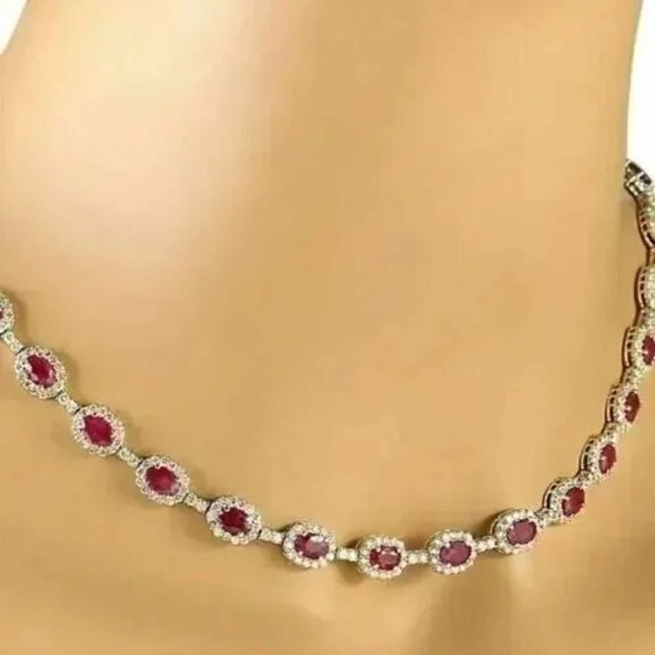 "22 Ct Oval Simulated Red Ruby Women's Tennis Necklace, 14K White Gold Plated, Halo Tennis Women's Necklaces ✤Details✤ Handmade item Ships from a small business in India Metal : Yellow Gold, Rose Gold, White/Silver Gold Finish Gemstone: Cubic Zirconia Gem color: Red Plating color: White  Style: Art Deco  Can be personalized Made to Order ✤Description✤ The most unique jewelry you can find, the perfect gift for you and your loved one.It Is Simulated Gemstone & Diamond And The Cut Of The Stone Is Excellent. The Product Is Available In All Types Of Gold Plated Such As White Gold Plated, Yellow Gold Plated, Rose Gold Plated. * Material : High Quality Solid 925 Sterling Silver * Metal Color: White/Yellow/Rose Gold and Made to Order. * Diamond type: Ruby * Diamond Color : Red  * Main Diamonds Cut Ruby Tennis Necklace, Red Oval Fine Jewelry, Fine Red Oval Jewelry, Oval Ruby Necklaces For Anniversary, Red Oval Diamond Jewelry, Oval Red Necklace For Anniversary, Red Oval Necklace For Anniversary, Red Oval Necklace For Formal Occasions, Red Oval Necklaces For Formal Occasions