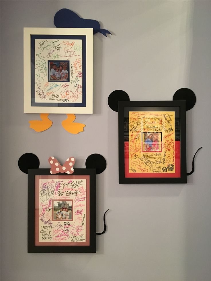 three framed mickey mouse heads are on the wall