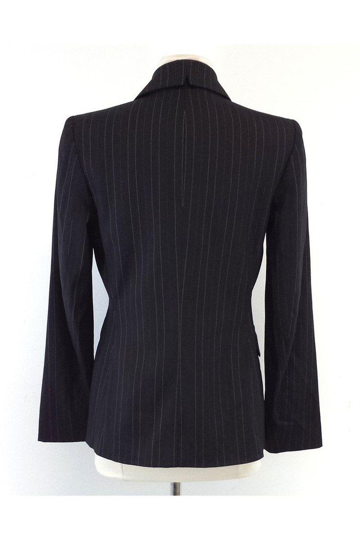 Size 4 Black Pinstripe Blazer Shell 67% wool 29% viscose 3% spandex 1% polyester Lining 100% polyester Padded shoulders Single front button close 2 front decorative flapover pockets White & black polka dot lining Shoulder to shoulder 15" Shoulder to hem 26" Fitted Blazer With Vertical Stripes And Long Sleeves, Fitted Long Sleeve Blazer With Vertical Stripes, Fitted Formal Outerwear With Vertical Stripes, Fitted Pinstripe Workwear Outerwear, Fitted Pinstripe Outerwear For Work, Fitted Striped Blazer For Business Casual, Elegant Striped Outerwear For Office, Fitted Striped Wool Outerwear, Striped Fitted Outerwear With Notch Lapel