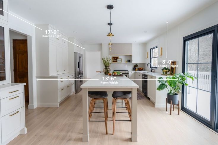 a kitchen with an island and bar stools