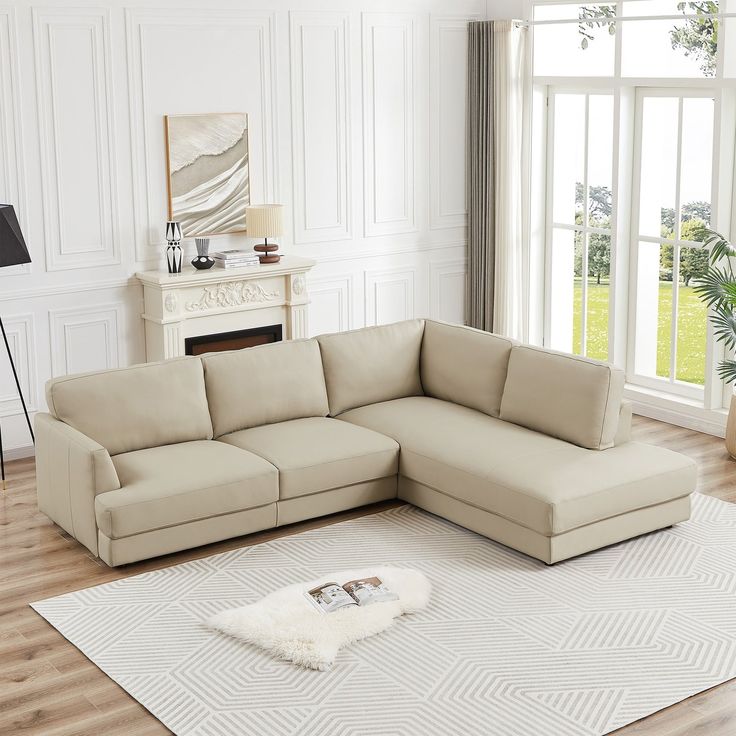 a living room with a sectional couch and rug