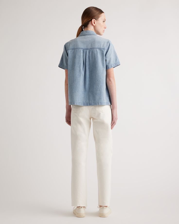 When easy does it, you need this Distressed Denim Short Sleeve Shirt. A total classic, it features a full button front, chest pockets, and a subtly distressed wash. The boxy fit feels like a modern update and looks amazing over figure-skimming skirts and pants.  | Quince | Women's Distressed Denim Short Sleeve Shirt in Blue, Size XS, Cotton Denim Short Sleeve Shirt, Chambray Shorts, Denim Short, Distressed Denim Shorts, Mink Pink, Navy Pants, Black Charcoal, Quince, Smart Casual