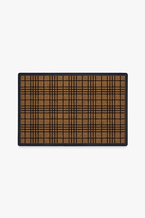 a brown and black plaid rug on a white background