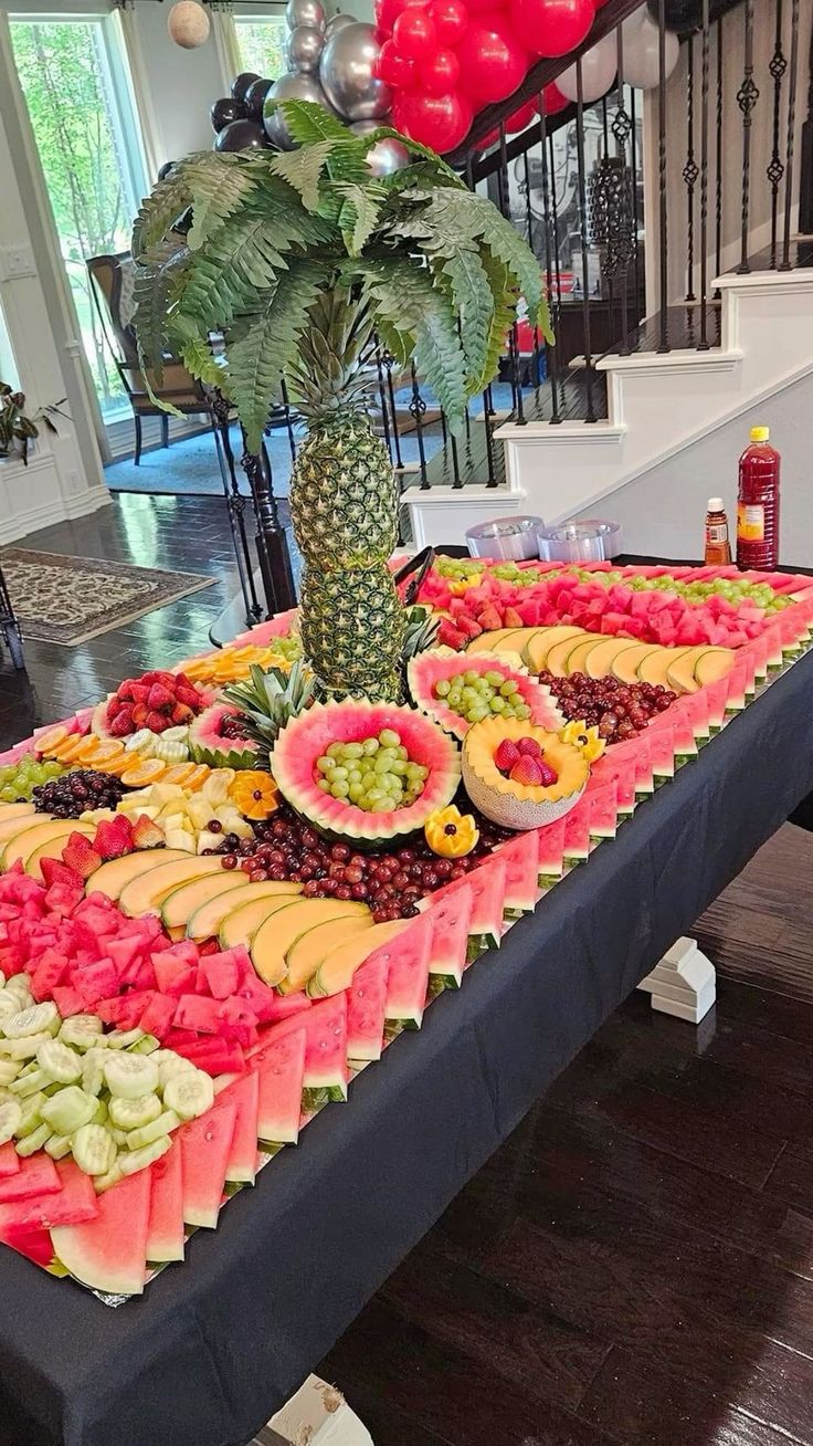 a table topped with lots of different types of fruits and veggies on top of it