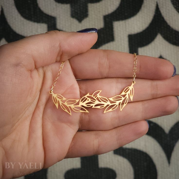 Vine Necklace – Minimalist necklace Featuring leaves branch outlines simple and elegant, this necklace will be sure to spruce up any outfit . ★ Comes in our signature gift box, ready for gift giving. ★ Available in Gold [18k gold-filled chain & gold plated brass pendant] ★Pendant size : 0.40"x2.20" . Thanks for shopping at ... Jewelry Design Shop, Vine Necklace, Leaves Necklace, Jewelry Design Studio, Gold Leaf Necklace, Mountain Jewelry, Meaningful Necklace, Nature Designs, Branch Necklace