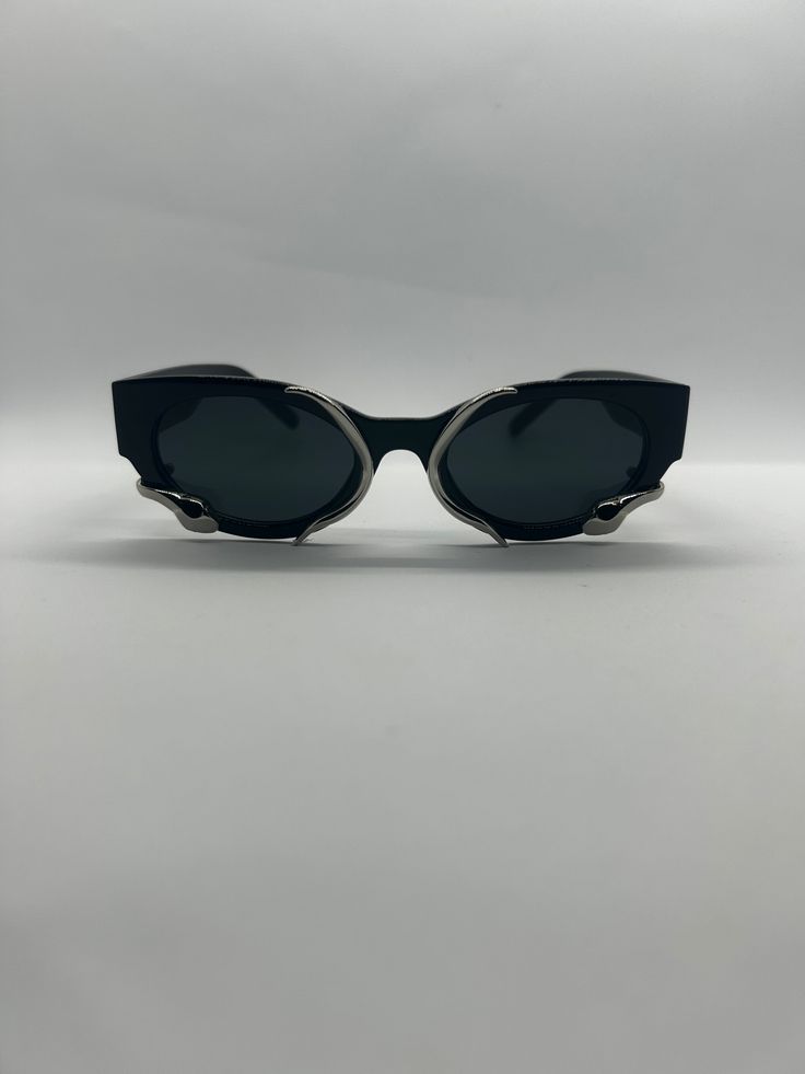 Our 'FLASH' sunglasses are just what you need to make a statement with your look and style. If you are tired of wearing the same type of sunglasses, 'FLASH' is exactly the pair of sunglasses you need. These circular sunglasses come with multiple colorful lens and a metal chrome design on the outside. A look for the ages in our honest opinion. *UV 400 Protection Metal Sunglasses With Tinted Lenses For Streetwear, Streetwear Metal Sunglasses With Tinted Lenses, Plastic Sunglasses With Gradient Lenses For Streetwear, Trendy Silver Cat Eye Sunglasses, Retro Black Metal Sunglasses, Futuristic Silver Sunglasses With Mirrored Lenses, Futuristic Cat Eye Sunglasses With Mirrored Lenses, Trendy Silver Shield Sunglasses With Polarized Lenses, Modern Metal Sunglasses For Parties