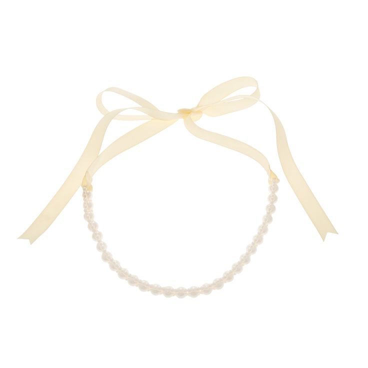 a white necklace with pearls and a ribbon