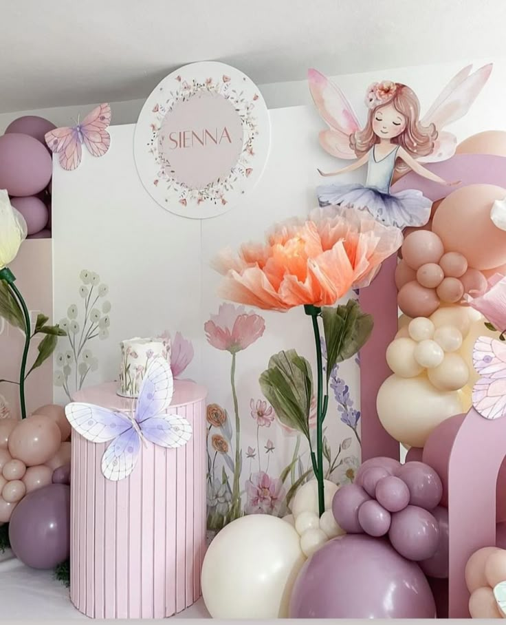 there are balloons and flowers on the wall next to boxes, vases and other decorations