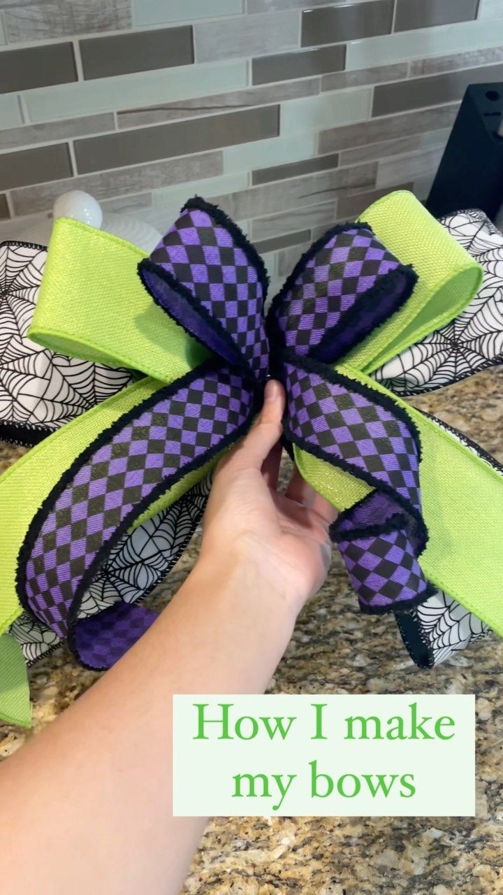 someone is holding a purple and green bow in their hand with the words how i make my bows on it